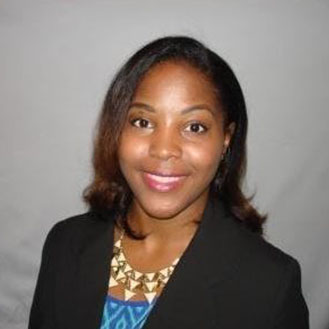 A woman in a black jacket and blue shirt